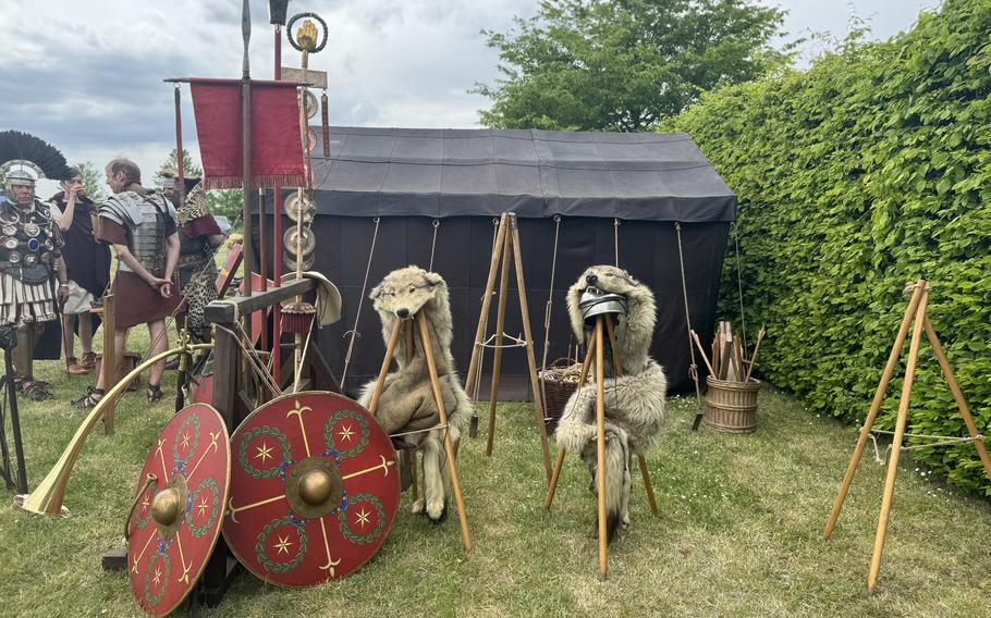 Set-up of the Roman camp featuring tents, shields and animal pelts.